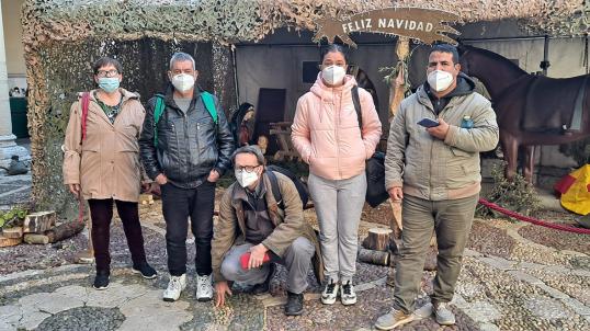 5 people standing, warm and wearing face masks