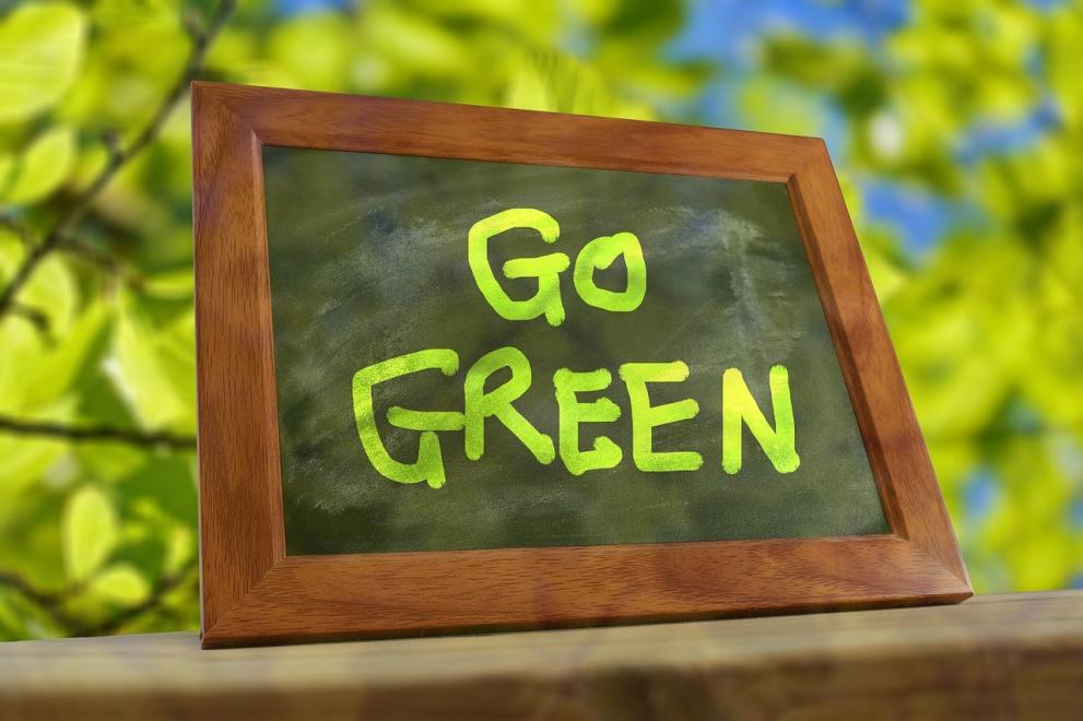 A picture with the phrase go green